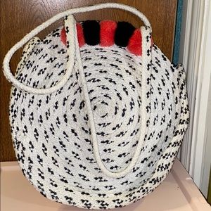 black and white with some black and pink pompoms